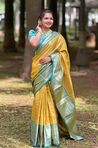 Yellow kanjivaram pattu traditional saree with zari weaves and contrast blouse