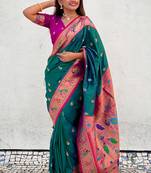 Dark green traditional rajhans paithani silk saree with contrast blouse