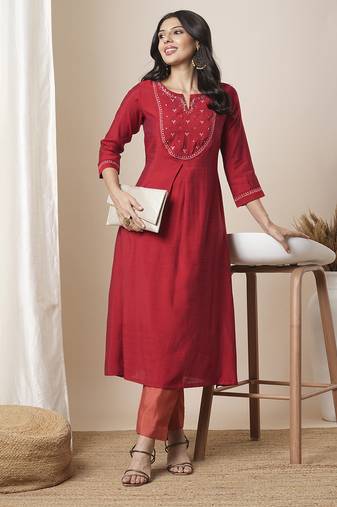 Flared avani silk kurta with a slit under the computer emboidred yoke.