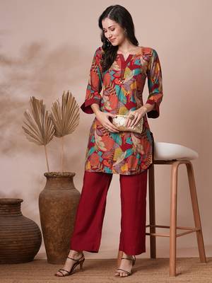 Printed center pleated co-ord set with stitchlines on neck and cuff with tassel detailing, paired with palazzo. 1