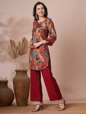 Printed center pleated co-ord set with stitchlines on neck and cuff with tassel detailing, paired with palazzo. 3