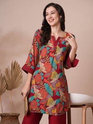 Printed center pleated co-ord set with stitchlines on neck and cuff with tassel detailing, paired with palazzo. 4