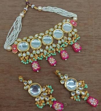 Traditional kundan choker necklace set with pearl string and matching earrings 1