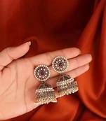 Exquisite kundan jhumka earrings with pearl accents