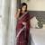 Maroon fancy jimmy chu embroidery work saree with embroidery stitched blouse