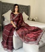 Maroon fancy jimmy chu embroidery work saree with embroidery stitched blouse