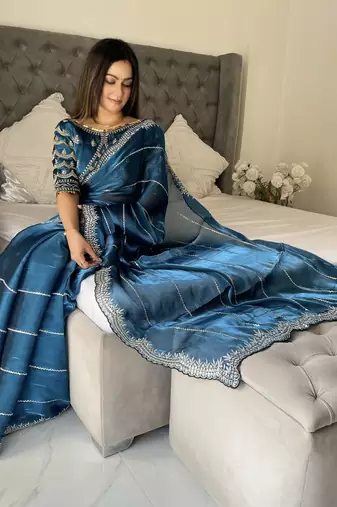 Light blue fancy jimmy chu embroidery work saree with embroidery stitched blouse