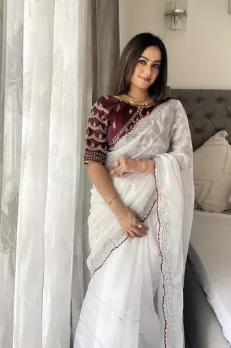 white fancy jimmy chu embroidery work saree with embroidery stitched blouse