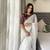 white fancy jimmy chu embroidery work saree with embroidery stitched blouse
