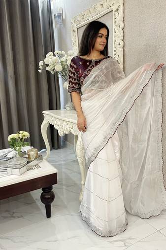 white fancy jimmy chu embroidery work saree with embroidery stitched blouse