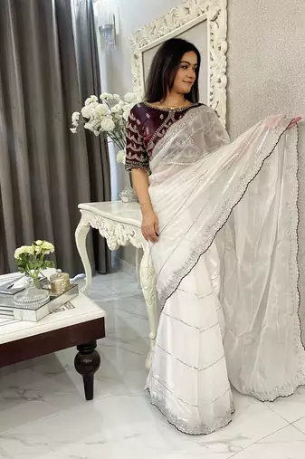 white fancy jimmy chu embroidery work saree with embroidery stitched blouse
