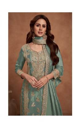 Light green heavy embroidery semi stitched silk wedding palazzo suits 2