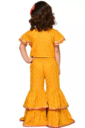 Saka designs girl mustard top and sharara with lace detailing and tassels