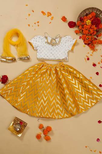Saka designs girls foil printed lacework white choli with mustard lehenga choli