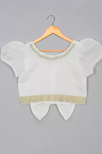 Saka designs white lehenga choli with dupatta adorned with golden border for girls