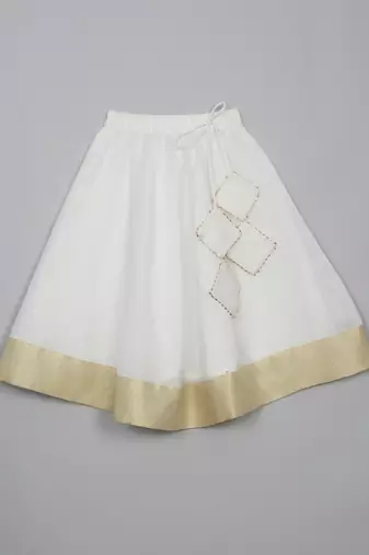 Saka designs white lehenga choli with dupatta adorned with golden border for girls