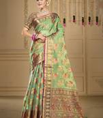 Sangam prints pista green organza woven work traditional saree