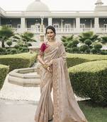 Beige tissue embroidered stone work designer saree