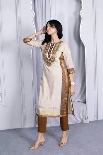 Nikhaa embroidered beige silk straight cut kurta & pants set