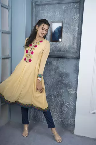 Nikhaa embroidered beige georgette a line kurta & pants set