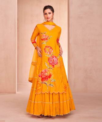 Yellow muslin embroidered sequins suit festive wear, bottom attached on top. 1