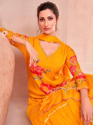 Yellow muslin embroidered sequins suit festive wear, bottom attached on top. 2