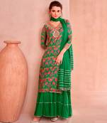 Green muslin embroidered sequins suit festive wear, bottom attached on top.
