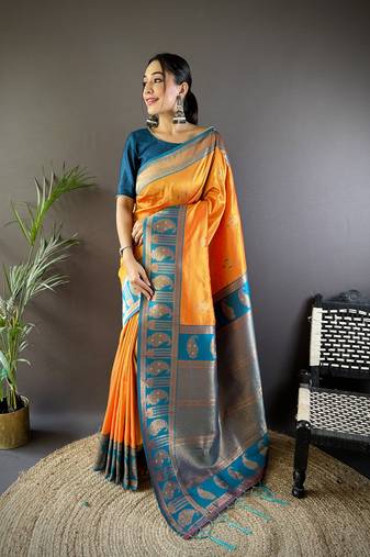 Orange soft banarasi silk saree with zari weaving and contrast blouse piece