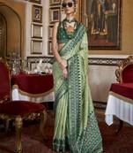 Soft silk woven printed patola designed saree (pista green)