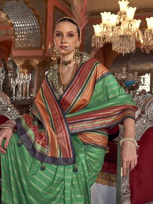 Soft silk stripped patola saree for women (green) 4
