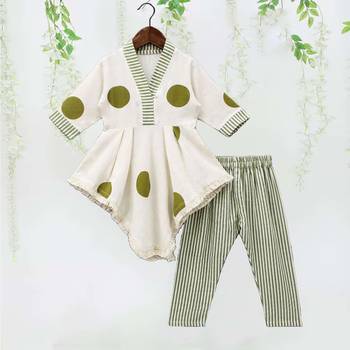 white polka dot asymmetrical kurti with green striped pant 1