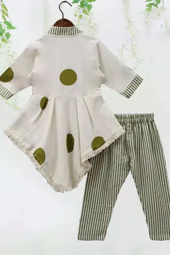 white polka dot asymmetrical kurti with green striped pant