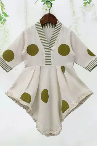 white polka dot asymmetrical kurti with green striped pant