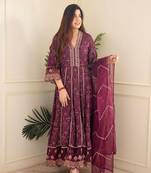 Bandhani printed and embroidered worked rayon kurti with pant and net dupatta