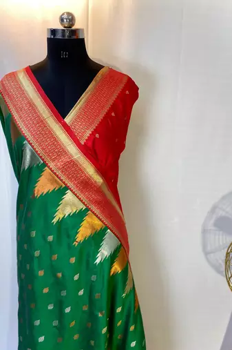 Green Foux Kanchipuram Sarees With A Temple Weaving Border With Contrast Blouse