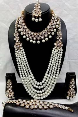 Luxury pearl and crystal bridal jewelry set - traditional indian wedding necklace set with earrings, tikka, and bracelet 1