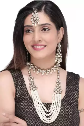 Luxury pearl and crystal bridal jewelry set - traditional indian wedding necklace set with earrings, tikka, and bracelet