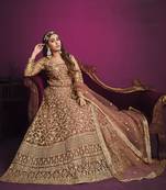 Peach color net sangeet anarkali salwar kameez