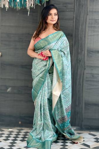 Sky blue assam silk floral printed saree with zari woven border