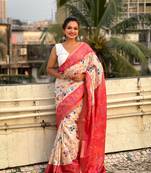 Coral red tussar silk kalamkari printed saree with zari woven border