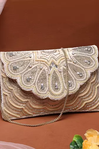 Anekaant tribal ivory & champagne scale & paisely embellished satin sling bag