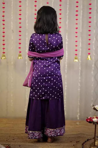Purple bandhej kurta with sharara set and dupatta.