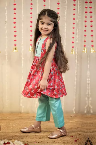 Pink block printed kurta with pants.