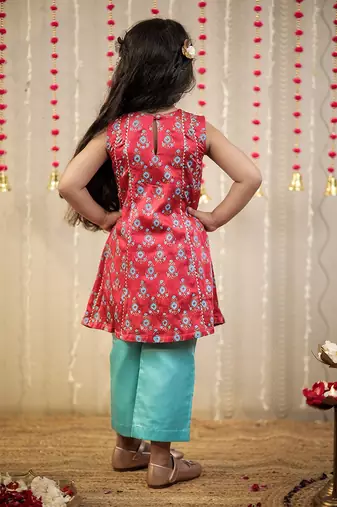 Pink block printed kurta with pants.