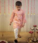 Peach orange block printed kurta set.
