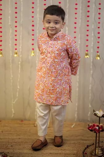 Peach orange block printed kurta set.