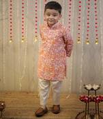 Peach orange block printed kurta set.