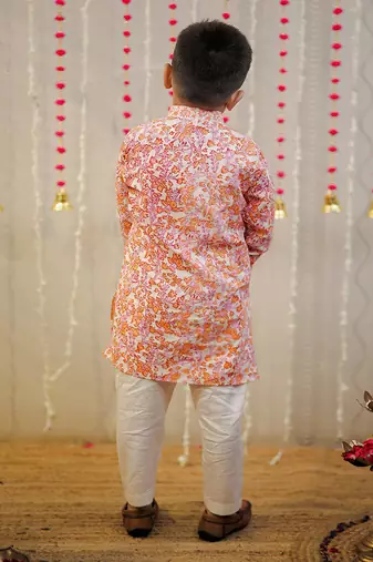 Peach orange block printed kurta set.