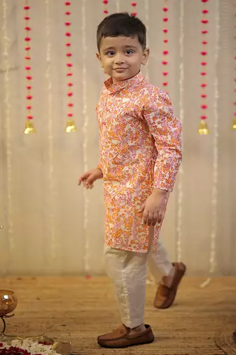 Peach orange block printed kurta set.