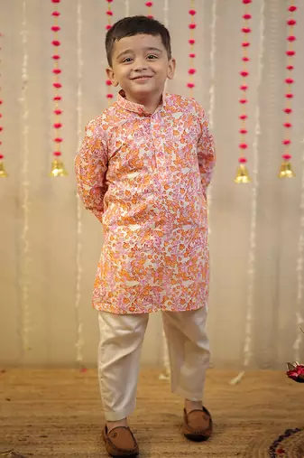 Peach orange block printed kurta set.